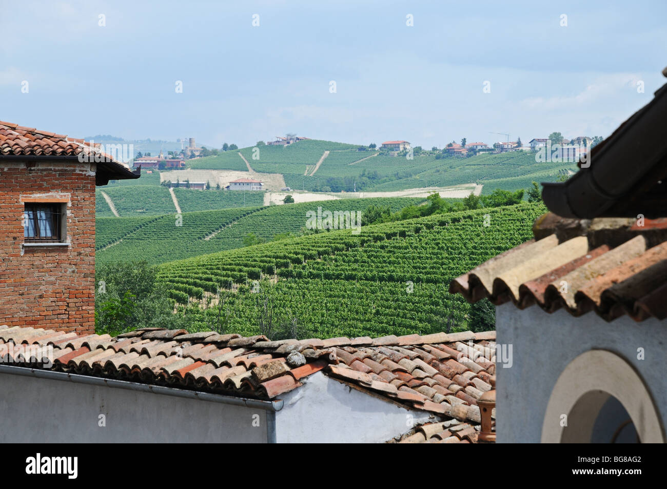 Clay tiled roofs and views of the vineyards around Barolo castle Langhe Piedmont Italy Stock Photo