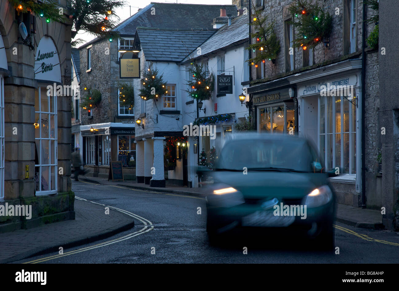 Car driving through Kirkby Lonsdale, Cumbria, England UK Stock Photo