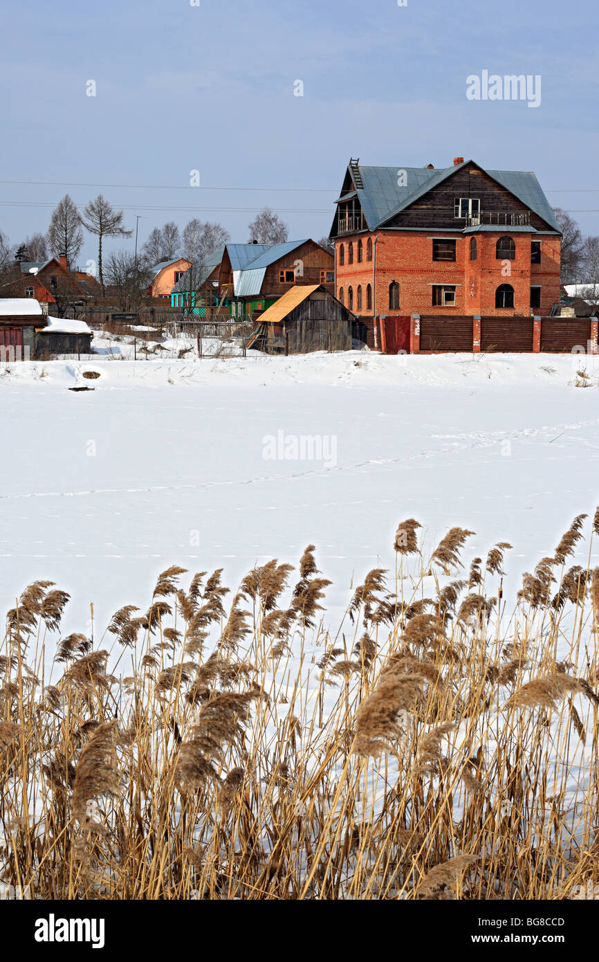 Rural cottages at winter, Russia Stock Photo