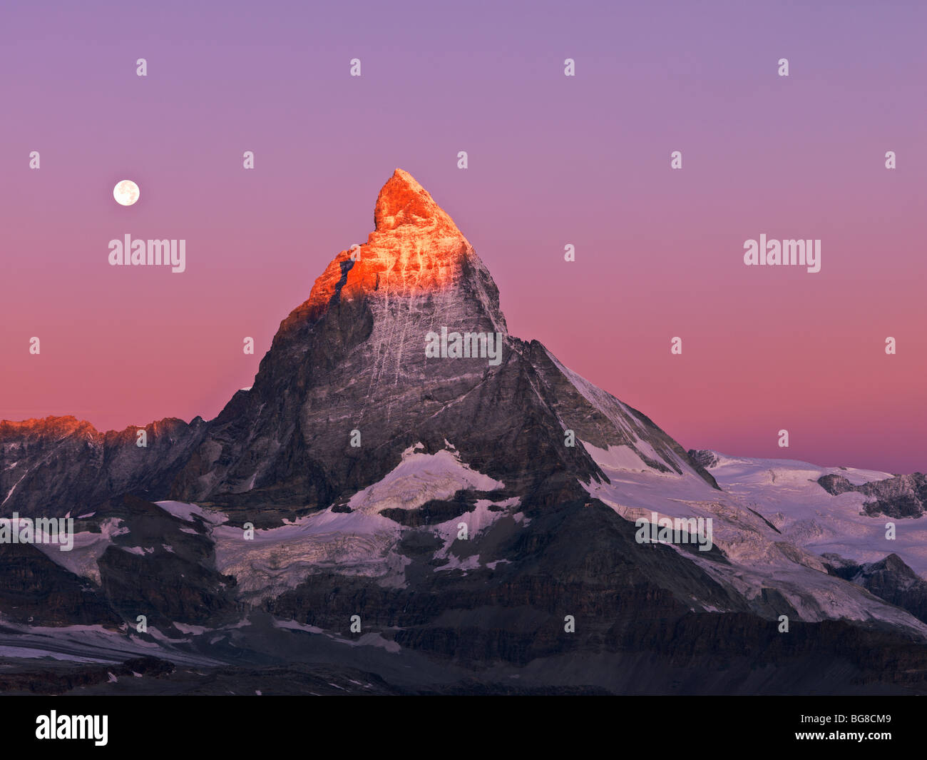 Switzerland, Valais, Zermatt, the Gornergrat,moon setting over the Matterhorn at dawn Stock Photo