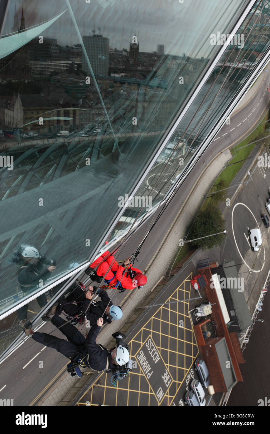BBC 'Blue Peter' presenter Joel Defries window cleaning for the program at the Sage Gateshead in
