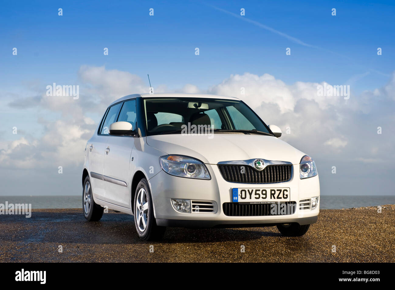 2009 Skoda Fabia Greenline front 3/4  in white with sea background Stock Photo