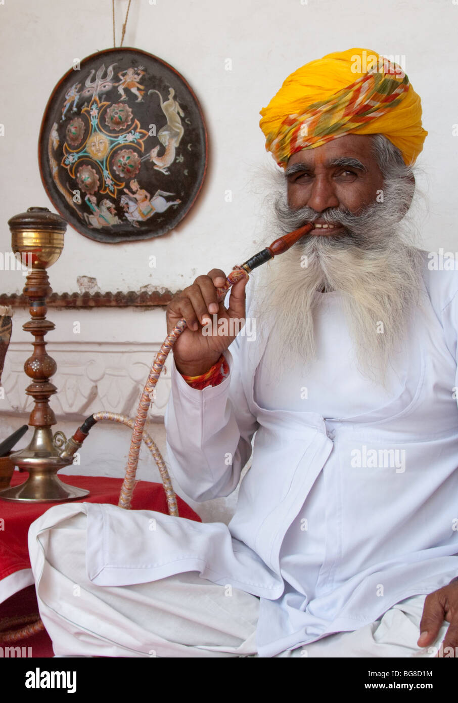 Indian man smoking hookah pipe Stock Photo