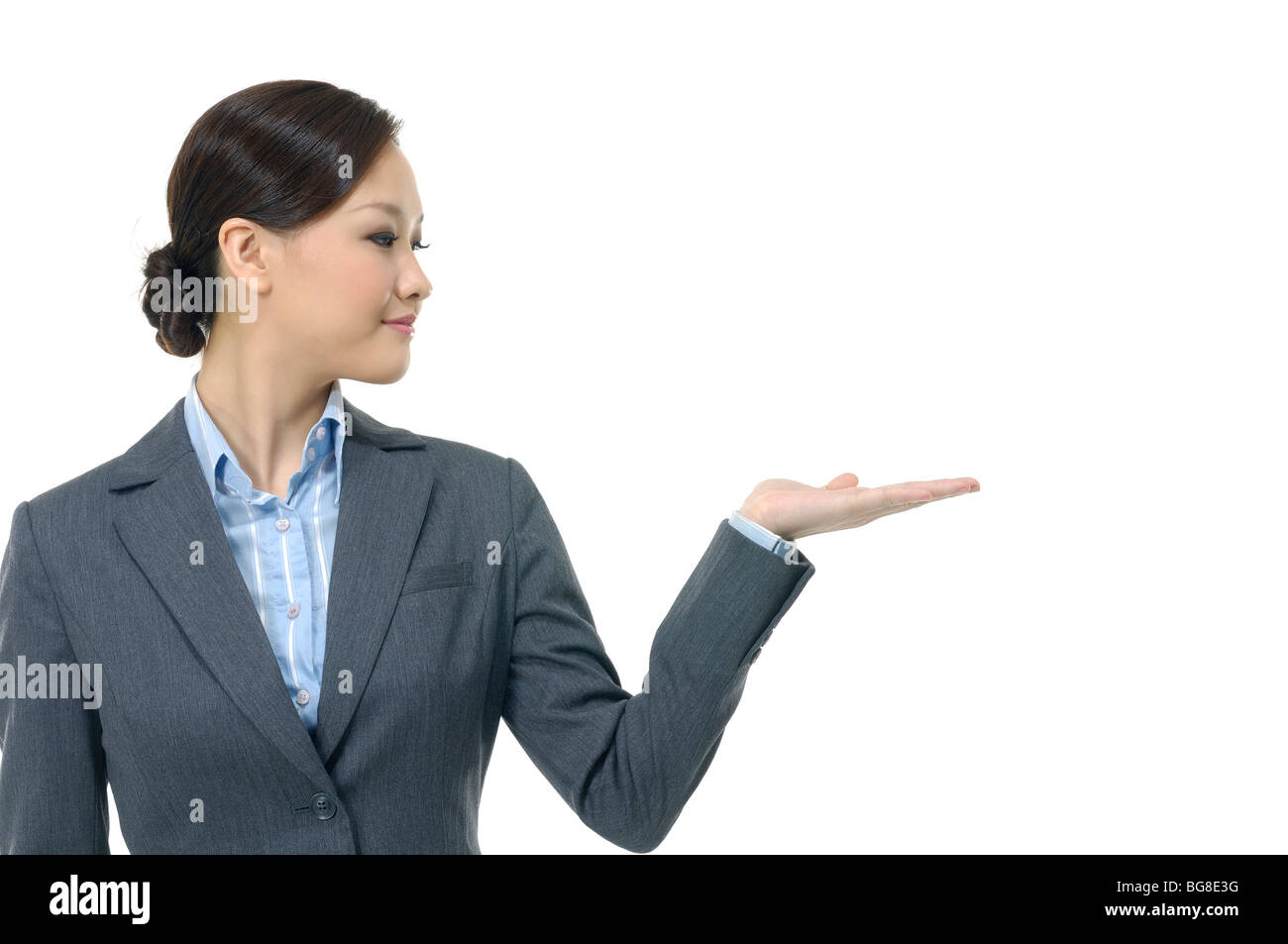 Businesswoman showing her palm Stock Photo - Alamy