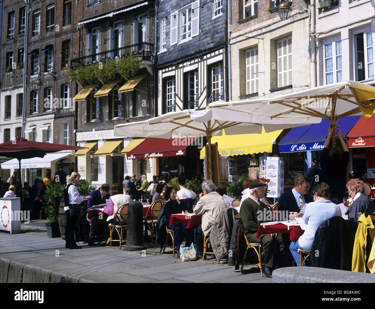 Honfleur, Normandy, France, Europe. People dining in outdoor cafes on