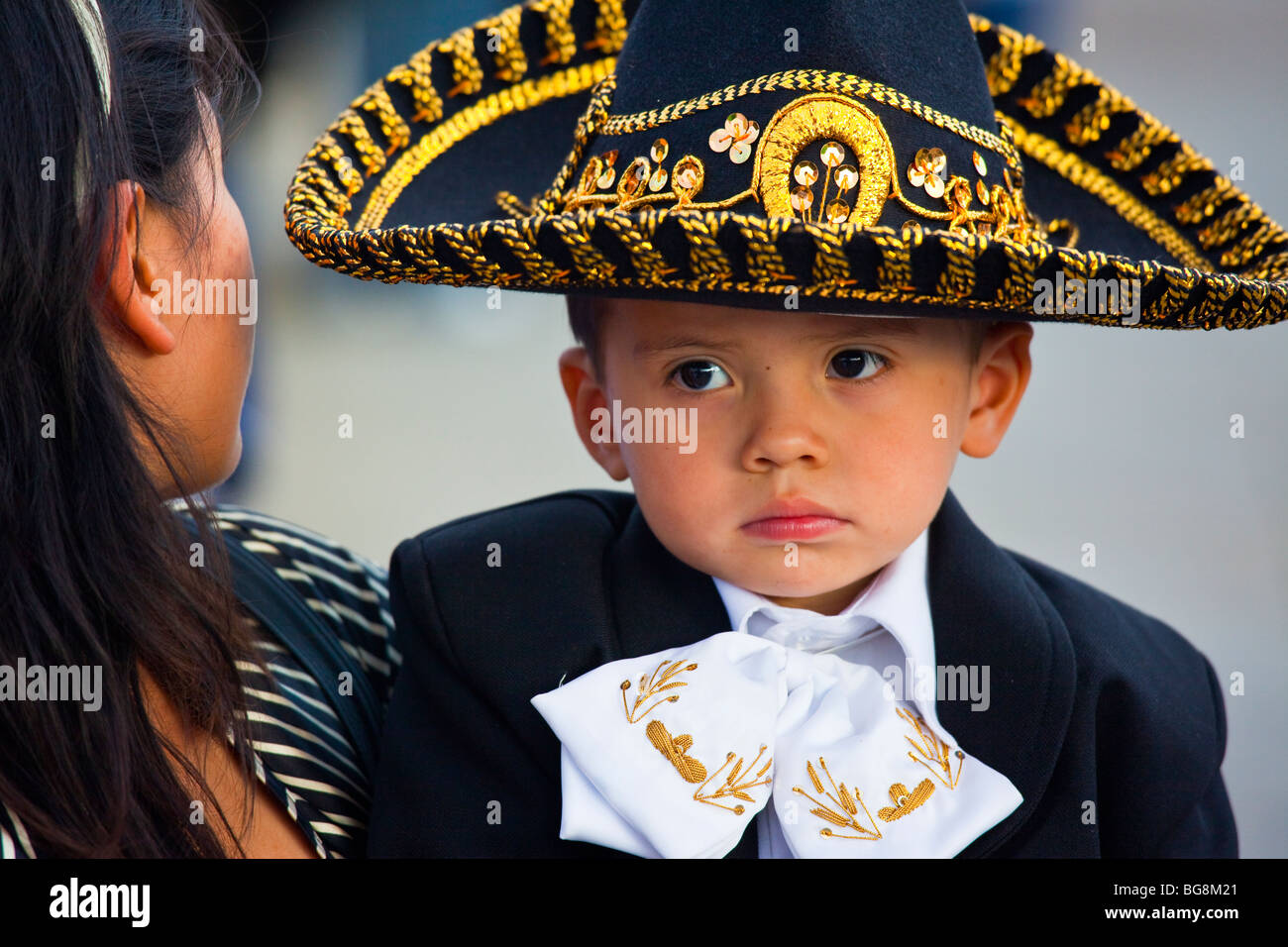 Boy dressed in a Mariachi costume at the Festival of Saint Cecilia in Plaza Garibaldi Mexico City Stock Photo