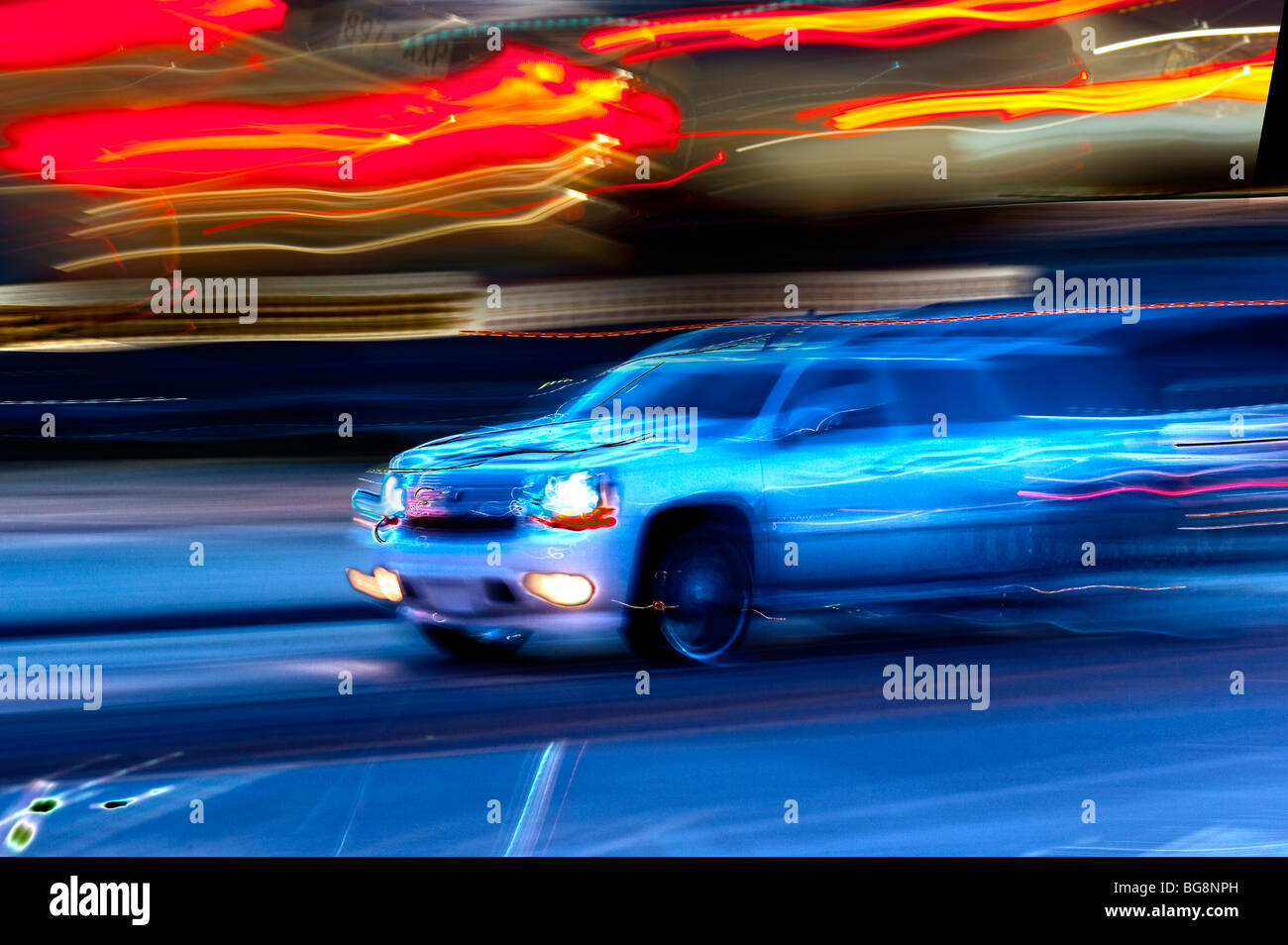 blurred car street racing at night Stock Photo