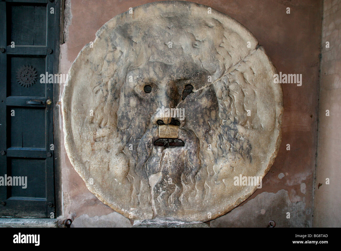 Roman Art. La Bocca della Verita 'The Mouth of Truth'. Ancient sculpture or masque of marble. I century A.D. Stock Photo
