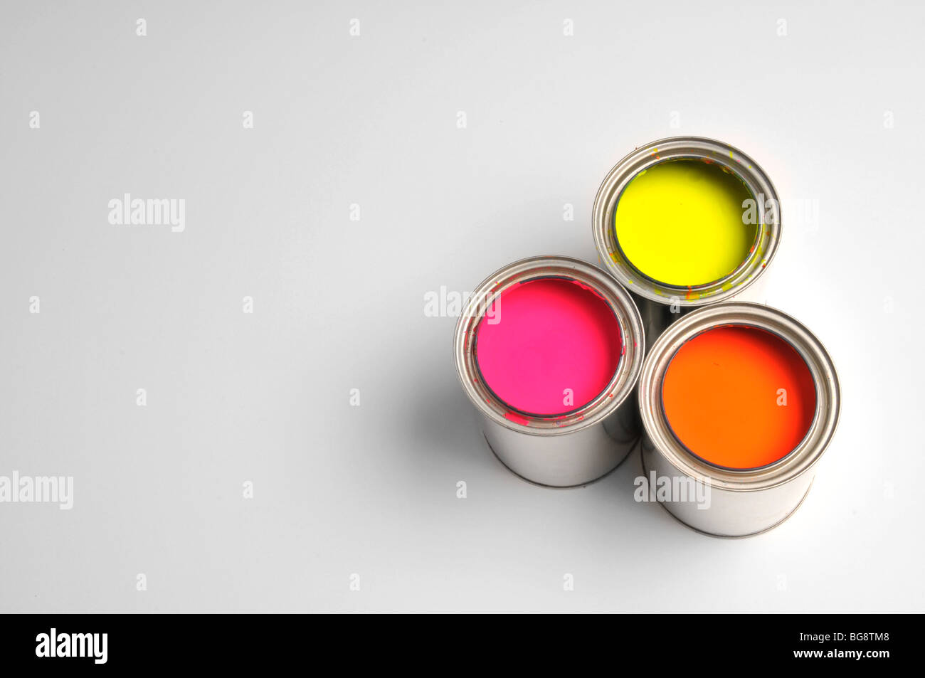 Cans of paint without a lid isolated on a gray background Stock Photo