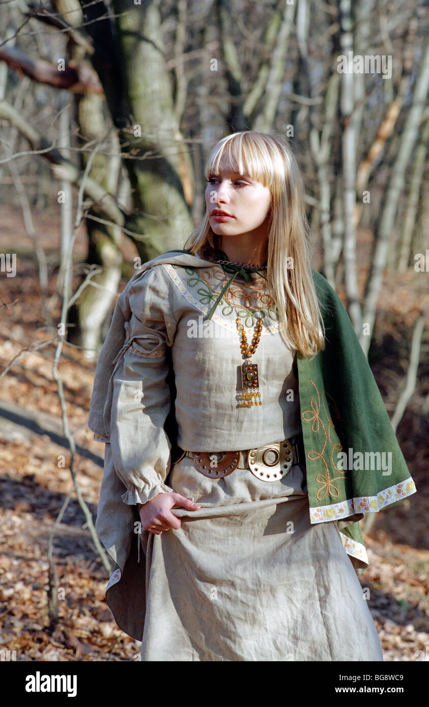 beautiful medieval woman walking in forest Stock Photo