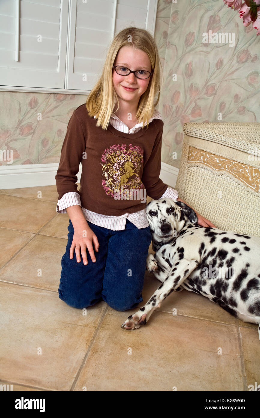 9-10 year old girl being affectionate with her pet child playing play plays dog showing affection love front view looking camera MR eye contact  © Myrleen Pearson Stock Photo