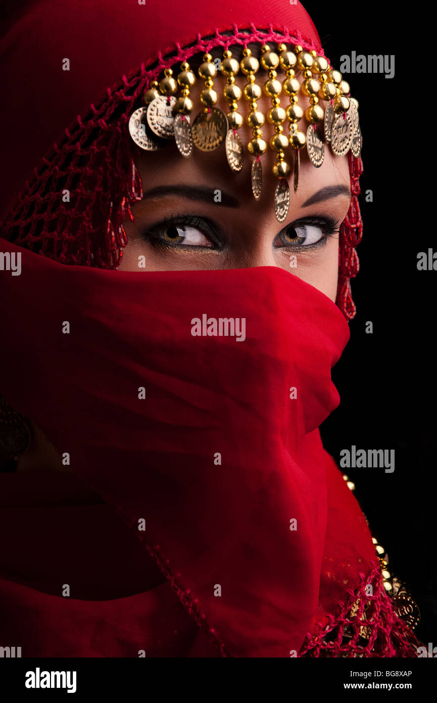 a beautiful woman wearing a red exotic veil Stock Photo