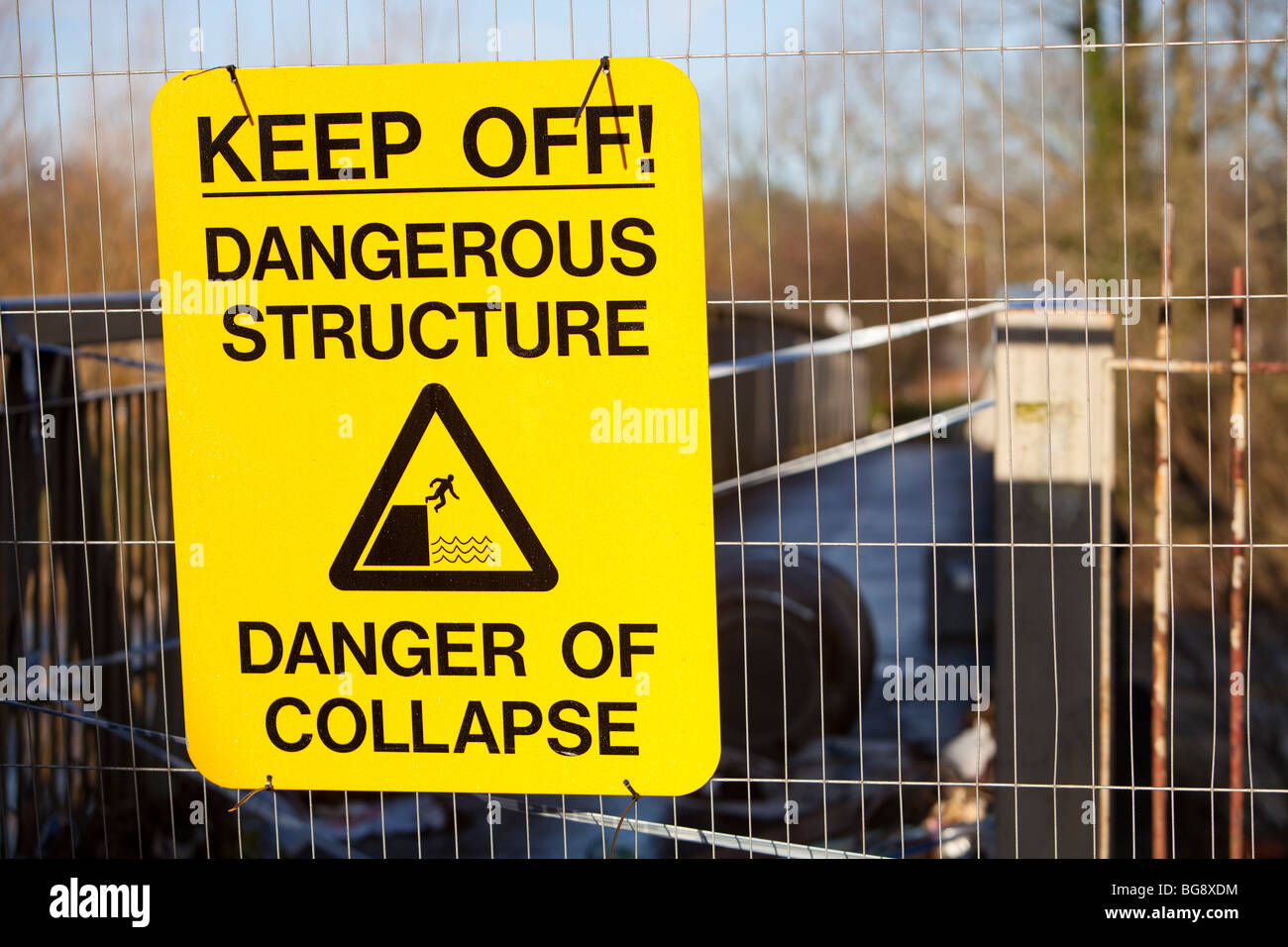 A warning sign on a bridge damaged by the floods, in Cockermouth Stock Photo