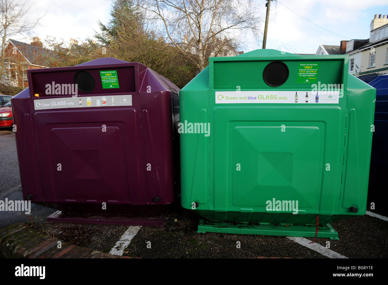 Two glass different coloured glass recycling bins Stock Photo Alamy