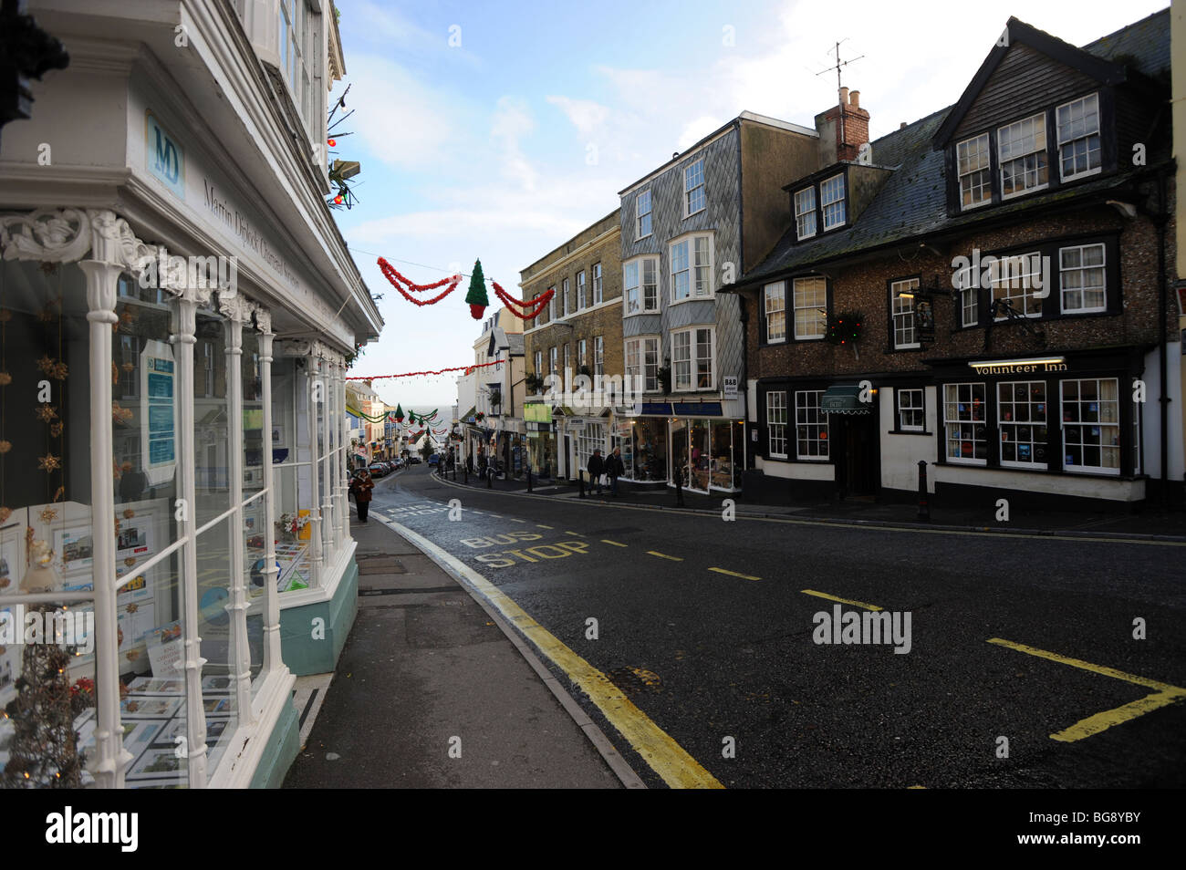 Lyme regis high street with sparse christmas decorations Stock Photo