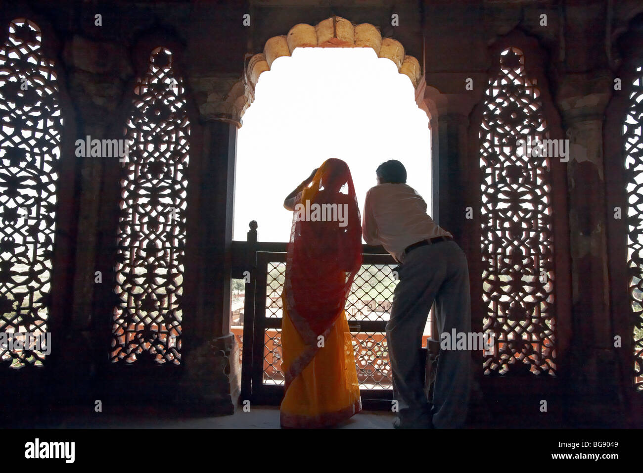 Young Indian Couple Looking out of a Balcony At Agra Fort Agra India Asia Stock Photo