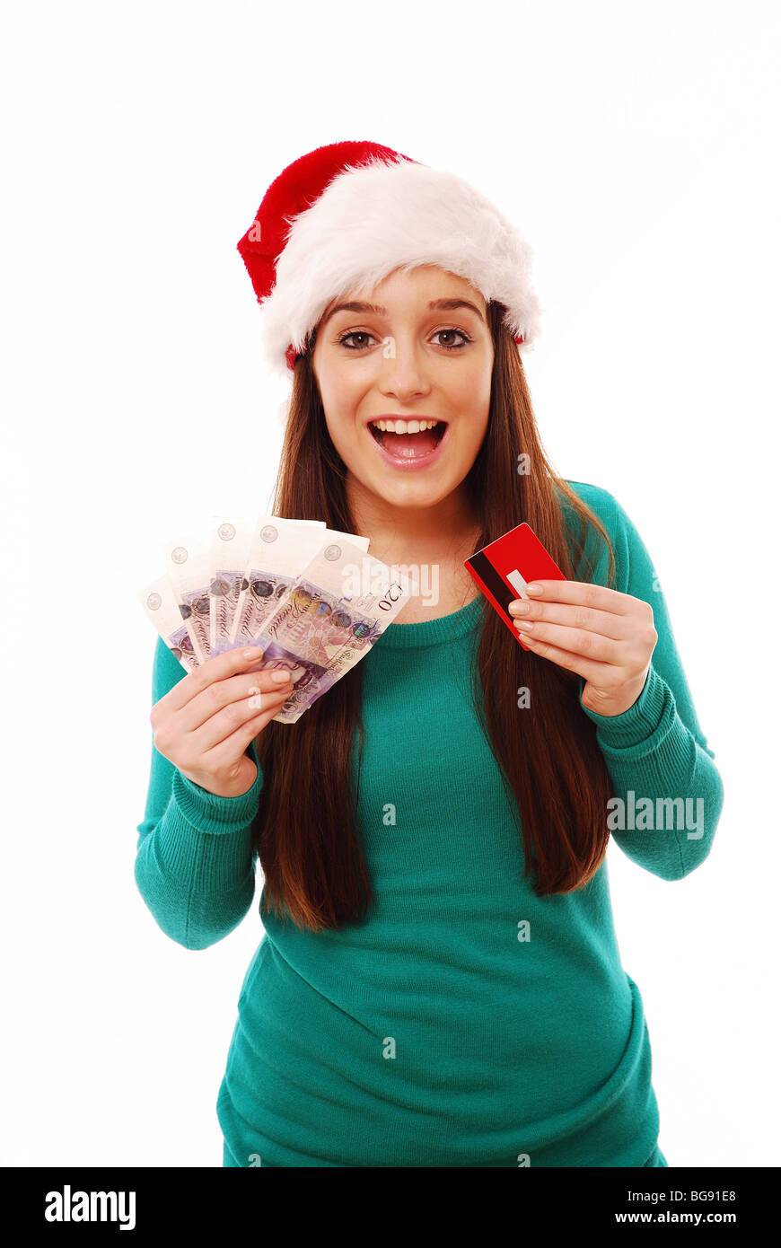 Young girl holding cash and a credit card Stock Photo
