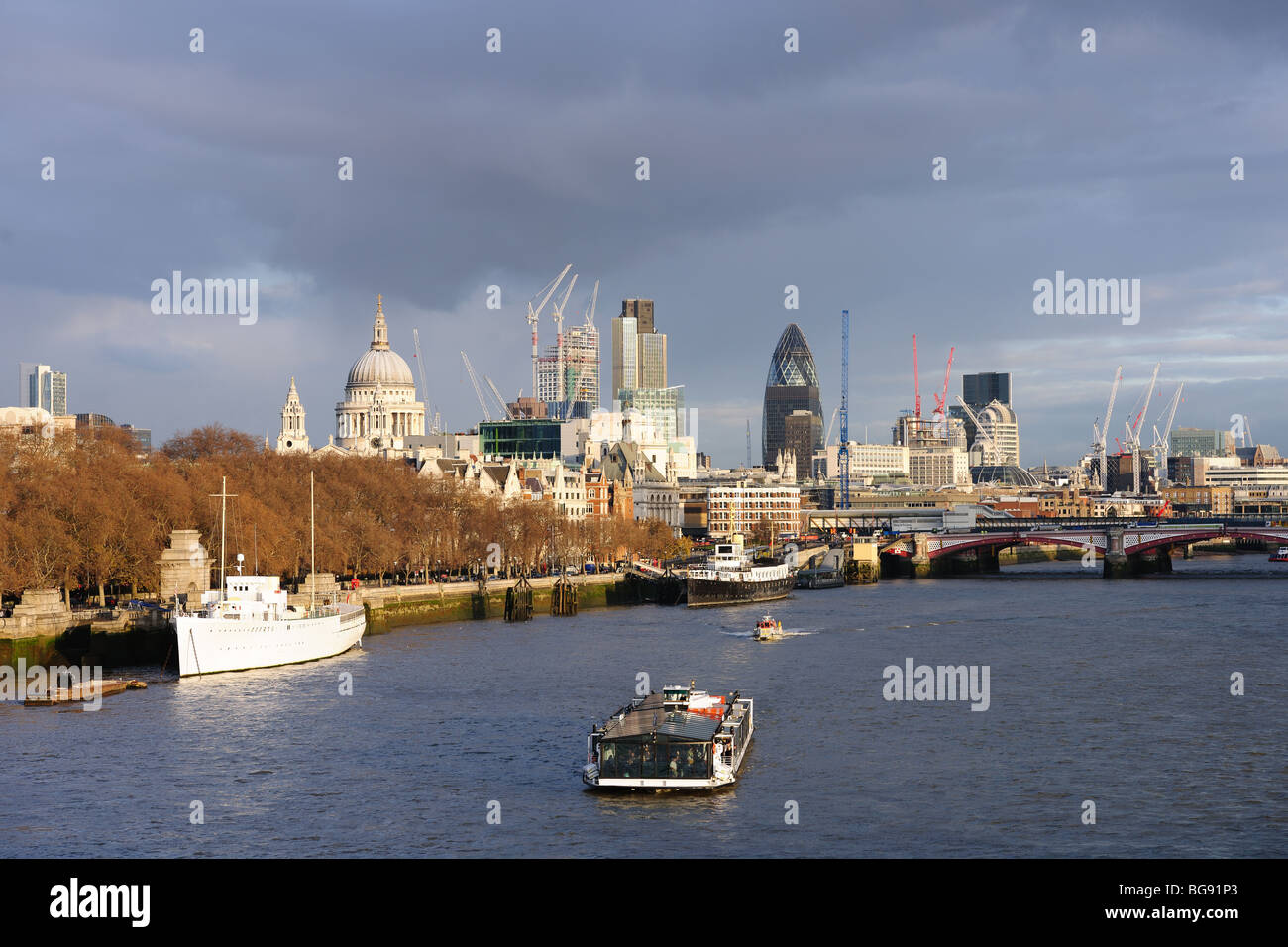 View over the River Thames, London, England, UK to St Paul's Cathedral, and the City, in warm winter light Stock Photo