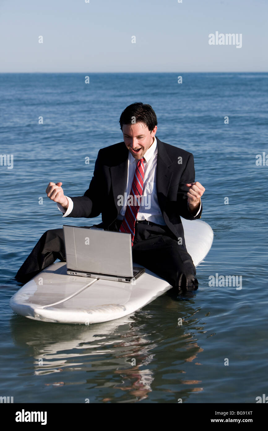 Young man having fun on a working vacation. Stock Photo