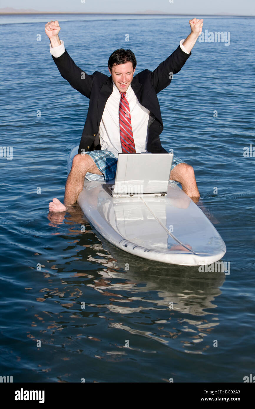 Young man having fun on a working vacation. Stock Photo