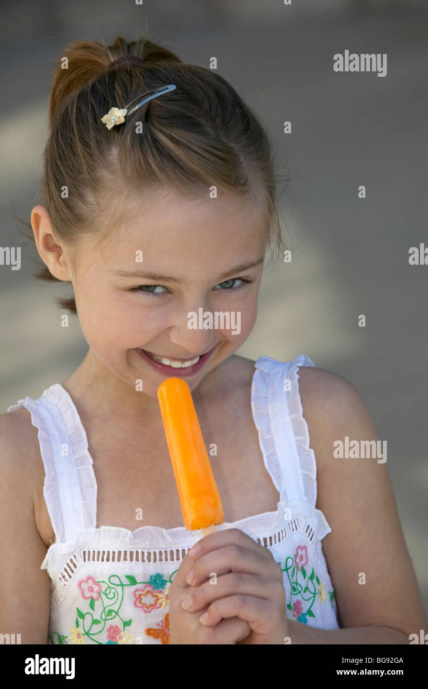 Girl holding orange popsicle Stock Photo 27244458 Alamy