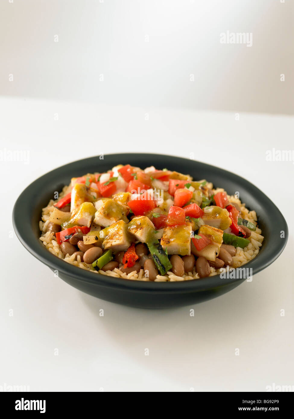 Grilled chicken fajita rice bowl on white Stock Photo