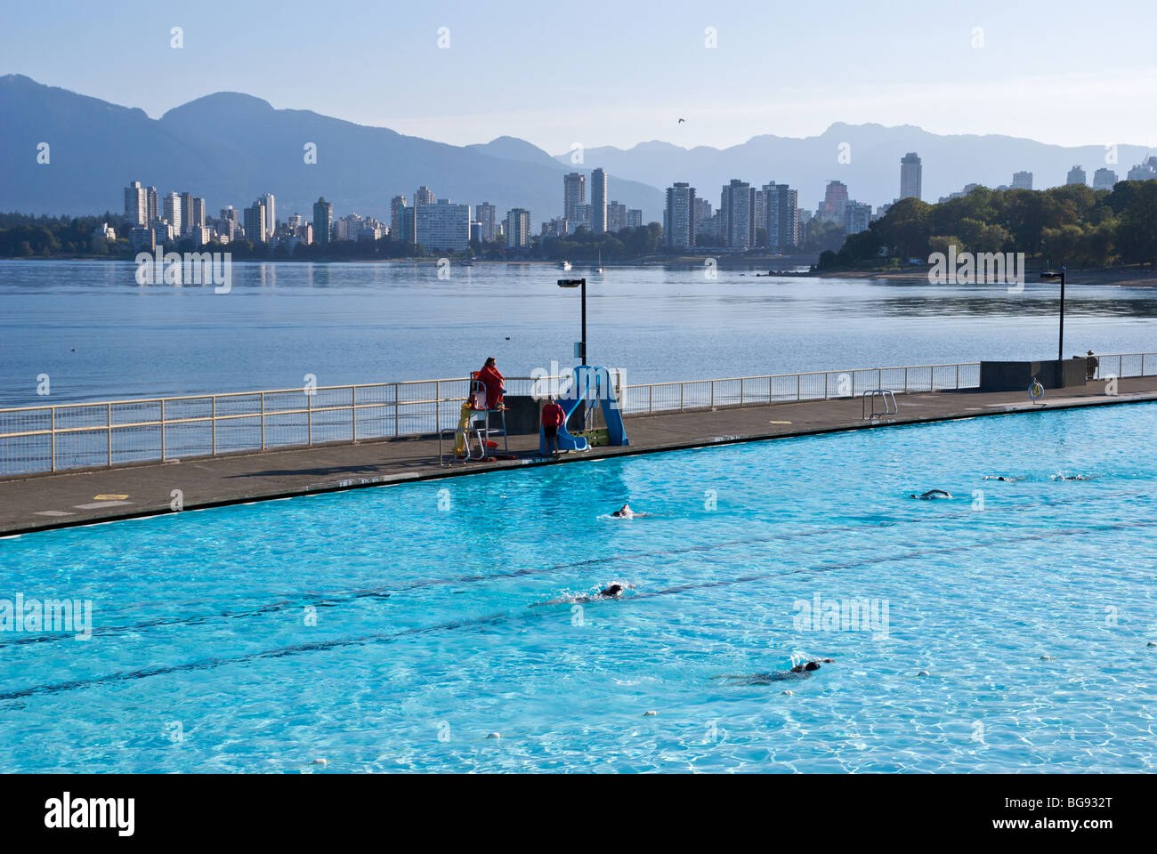 Swimmers traverse Kitsilano Pool on Vancouver's English Bay Stock Photo