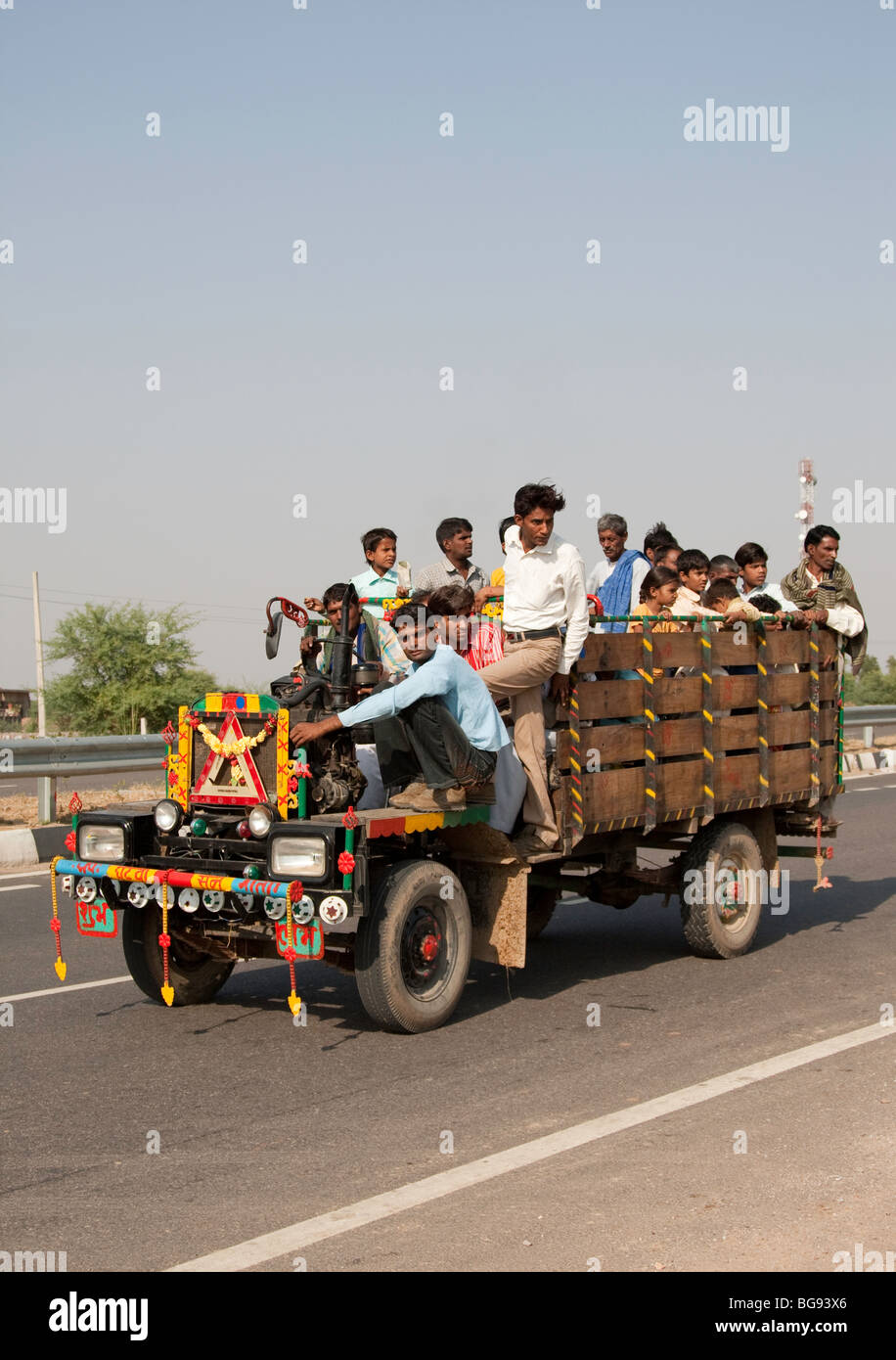 Stock photo of Typical rural transport, overloaded van with people,  Maharashtra, India. Available for sale on
