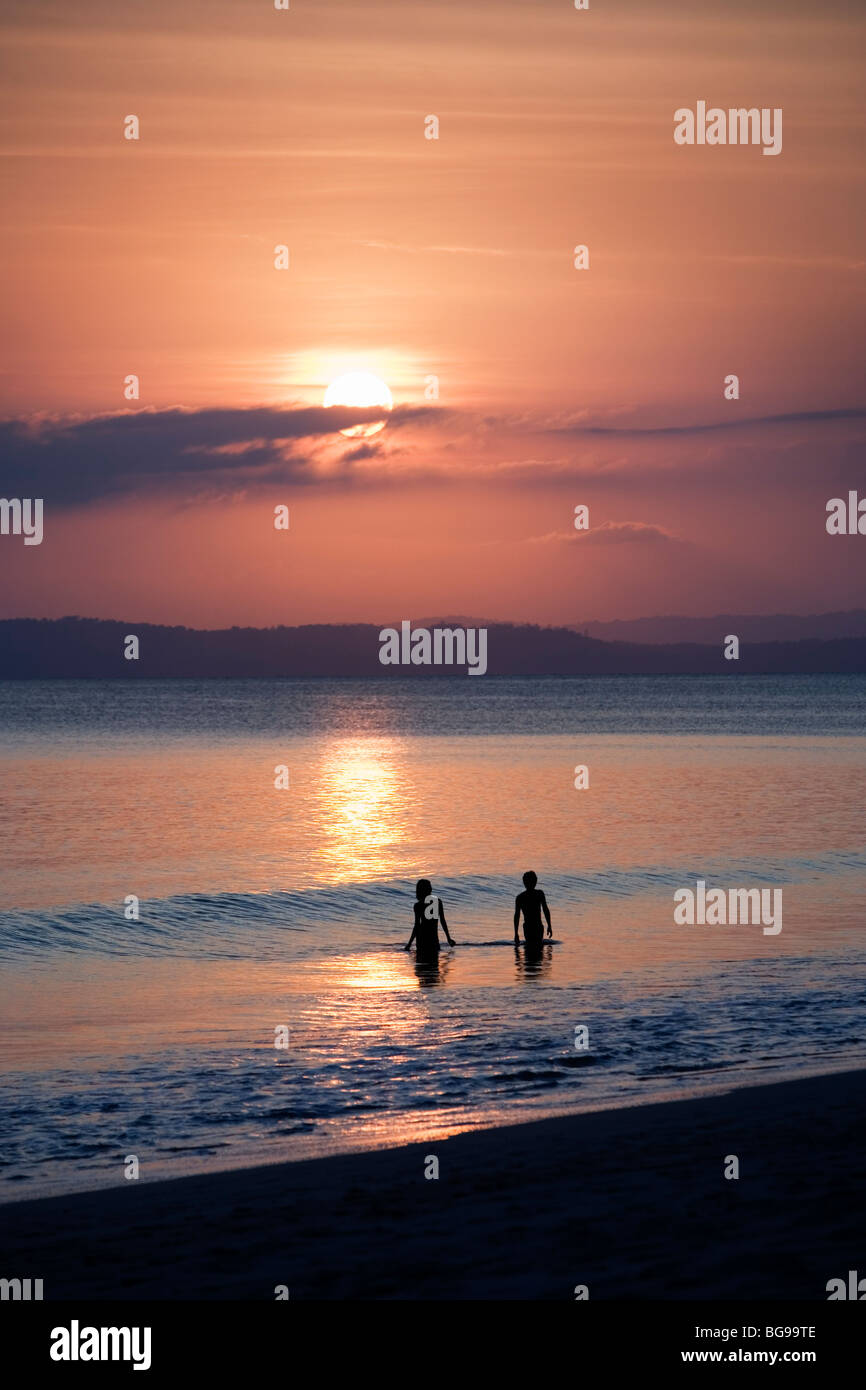 A couple watching the sunset on Beach number 9 on Havelock island