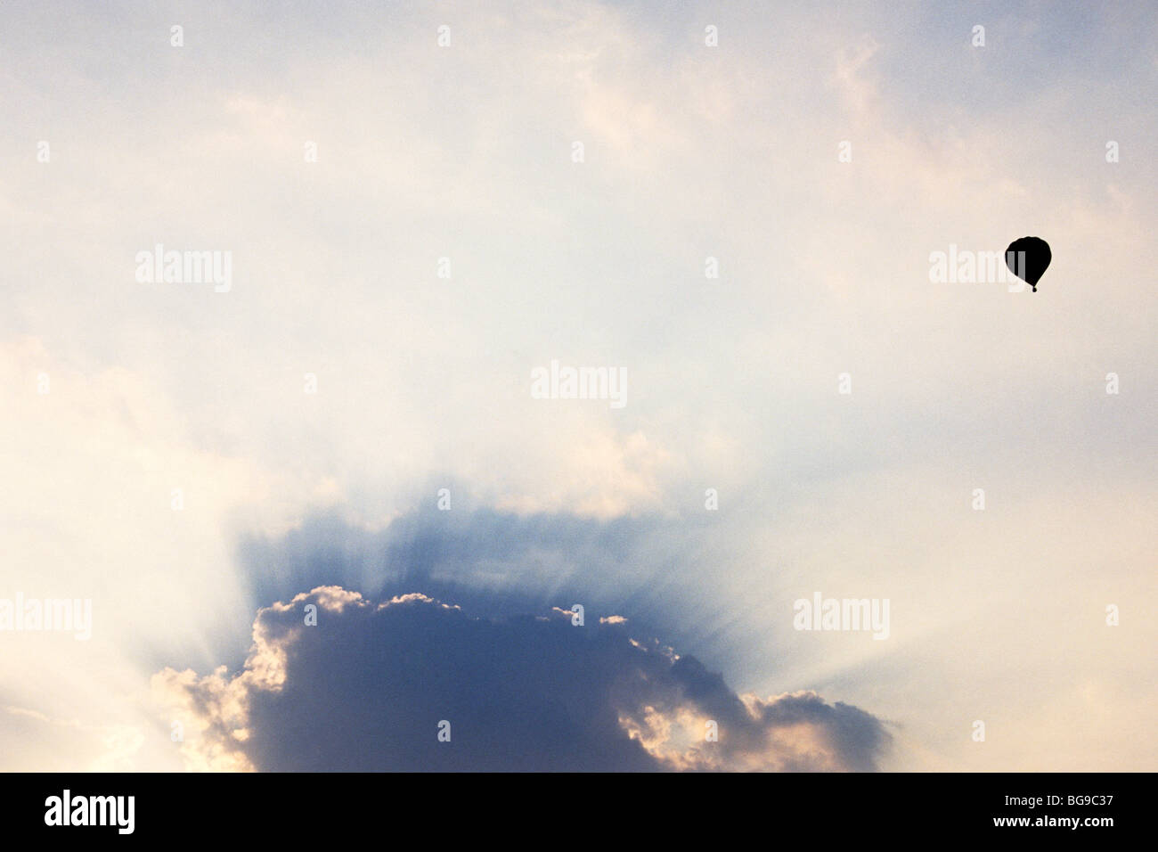 Hot air balloon in flight high in the sky Stock Photo - Alamy