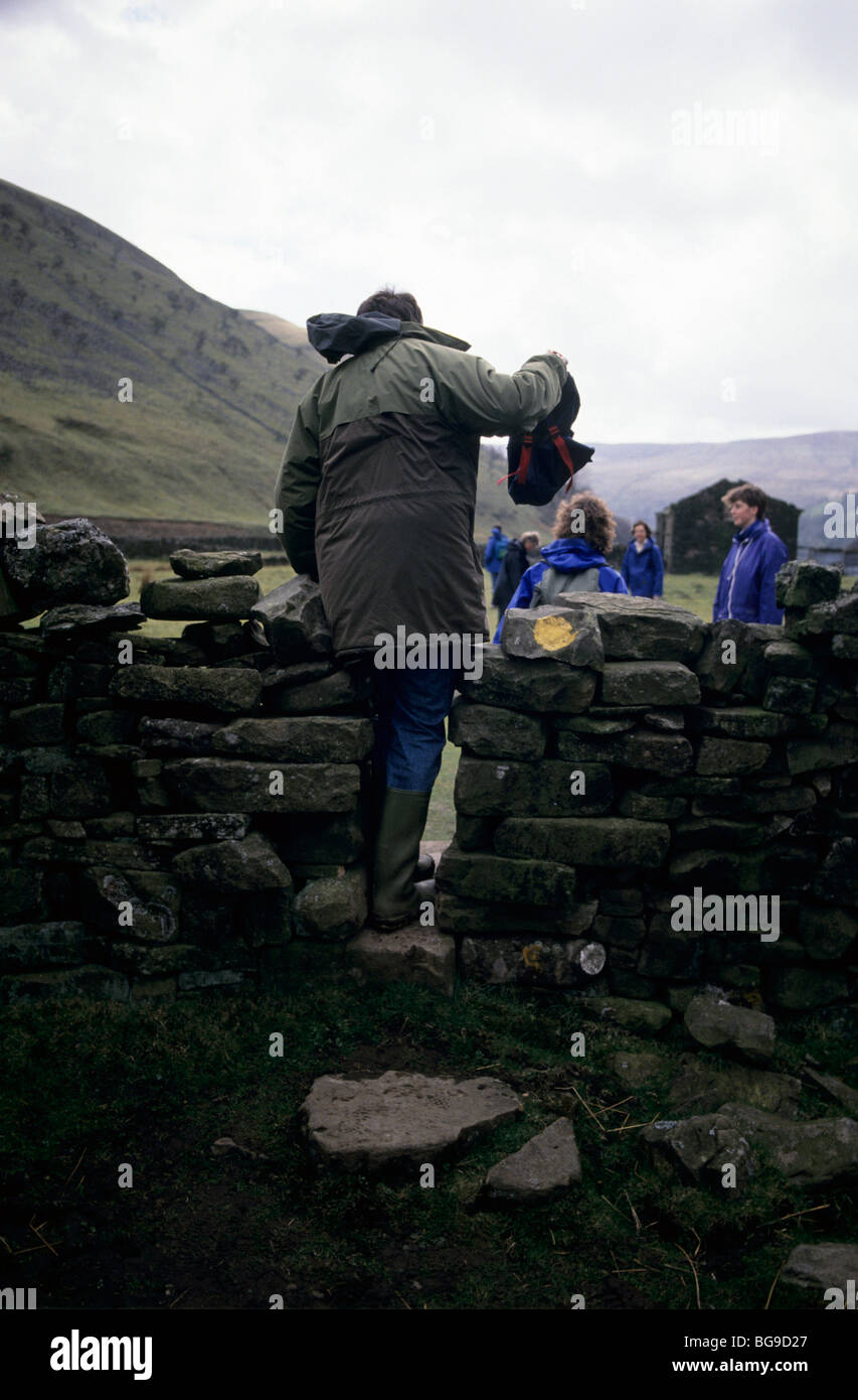 Man climbing through rock hi-res stock photography and images - Alamy