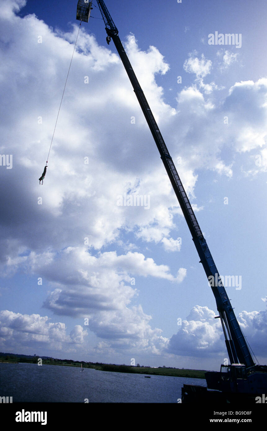 Bungee jumper hanging from a crane Stock Photo Alamy