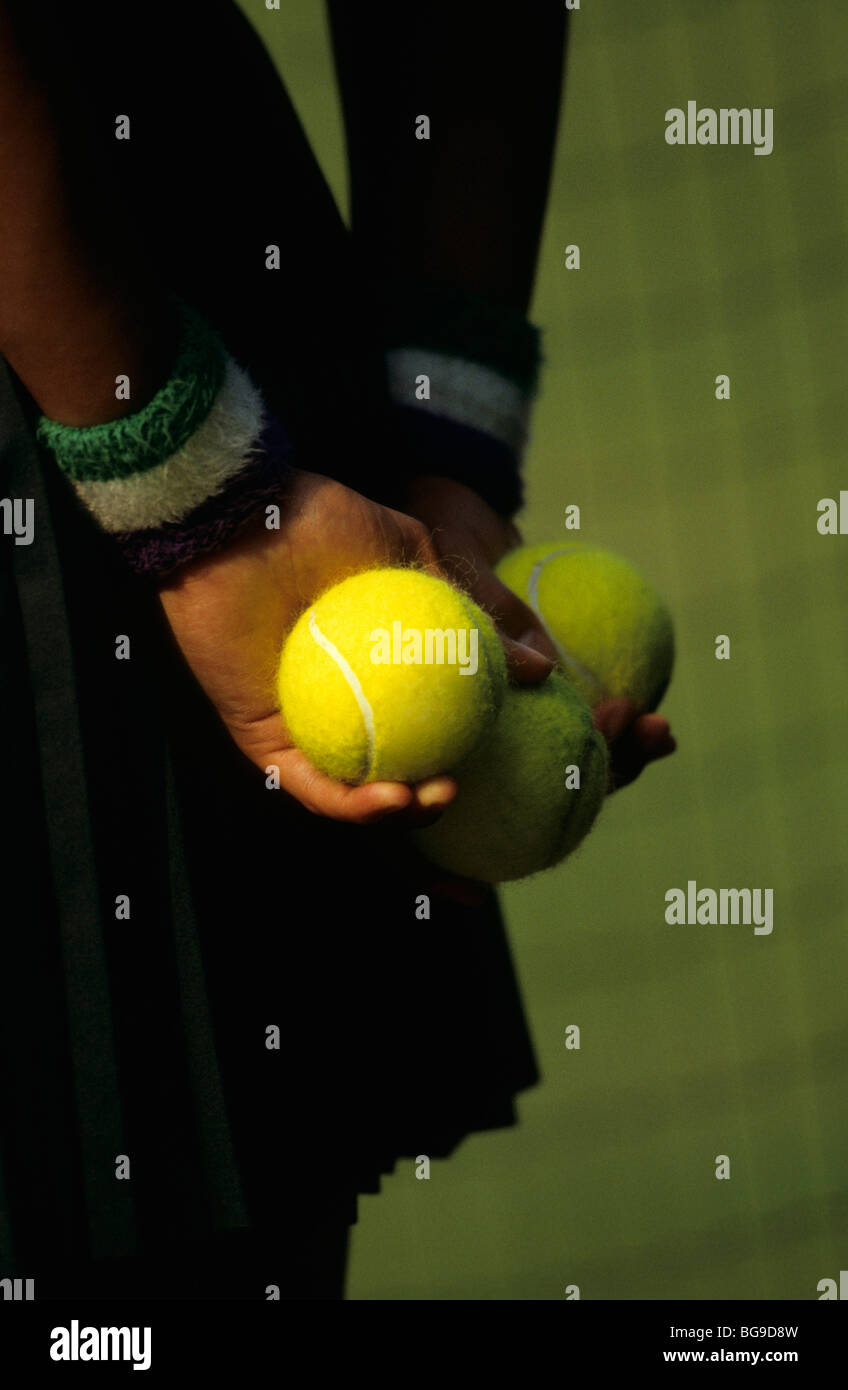 Close up of a ball girl holding tennis balls Stock Photo Alamy