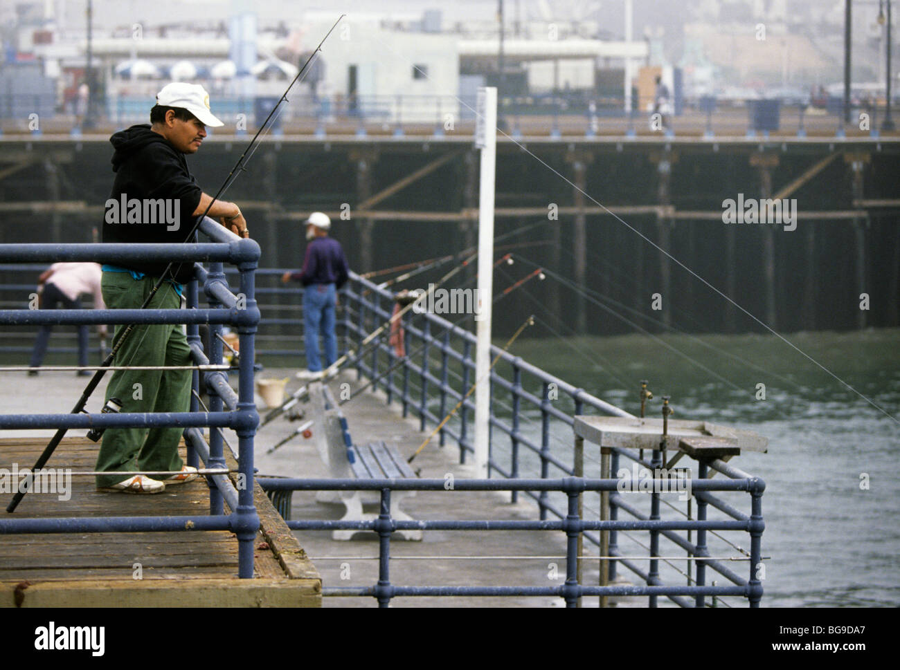 ''pier fishing'' rods hi-res stock photography and images - Alamy