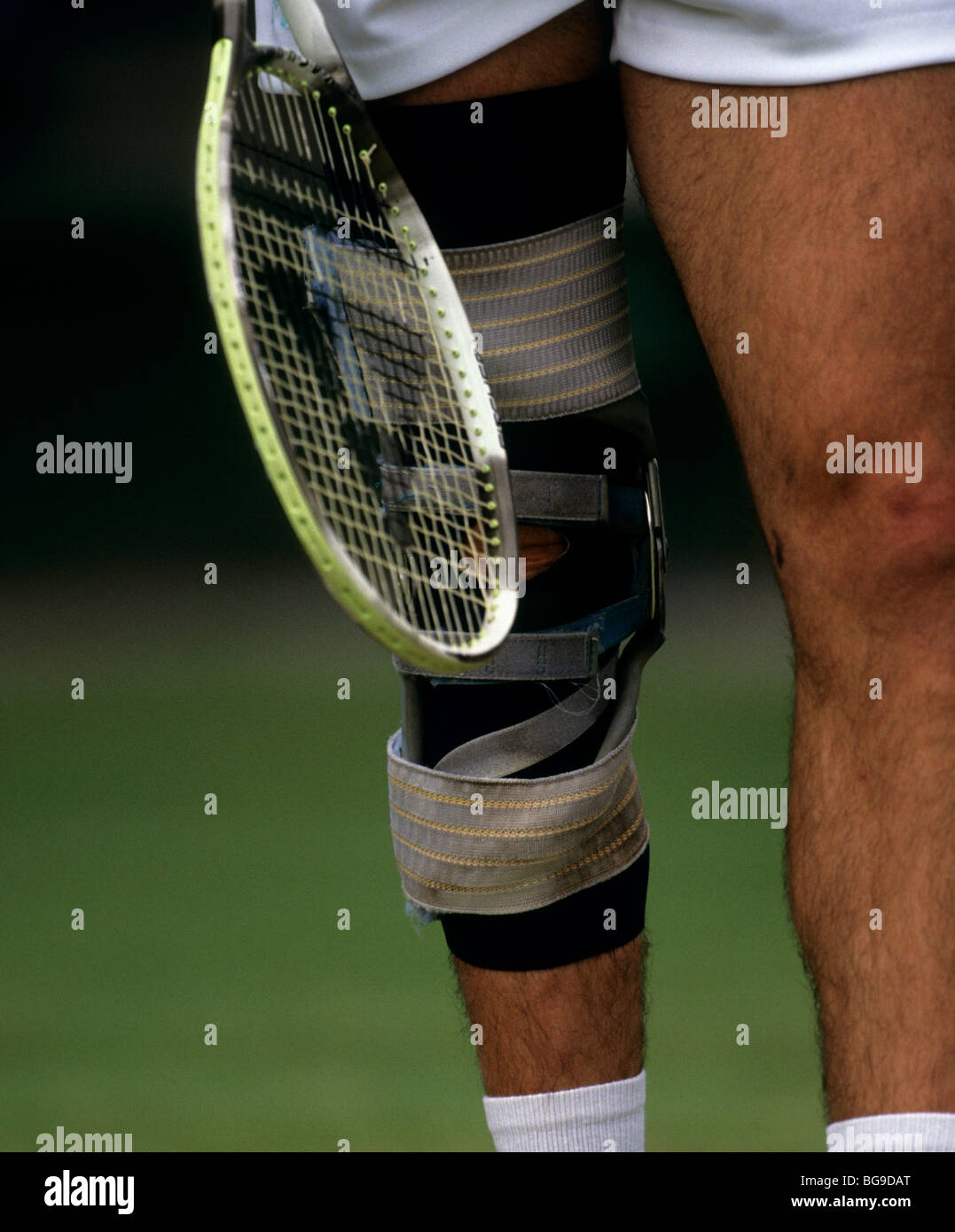Tennis player wearing a knee brace Stock Photo - Alamy