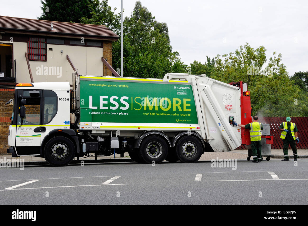 Waste Truck with "More is Less" on the side, two male operatives
