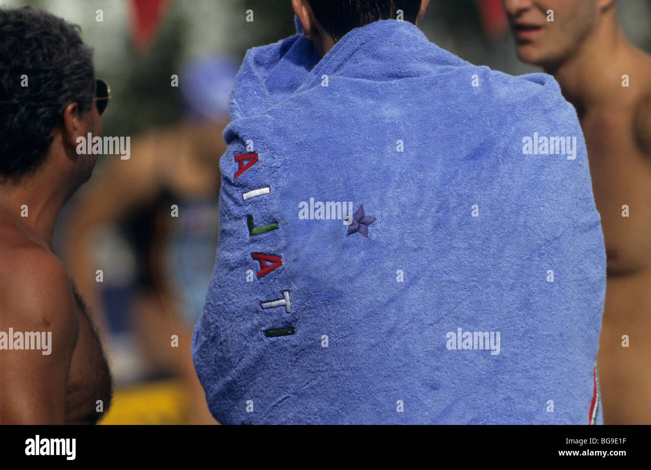 Swimmer wearing a towel Stock Photo Alamy
