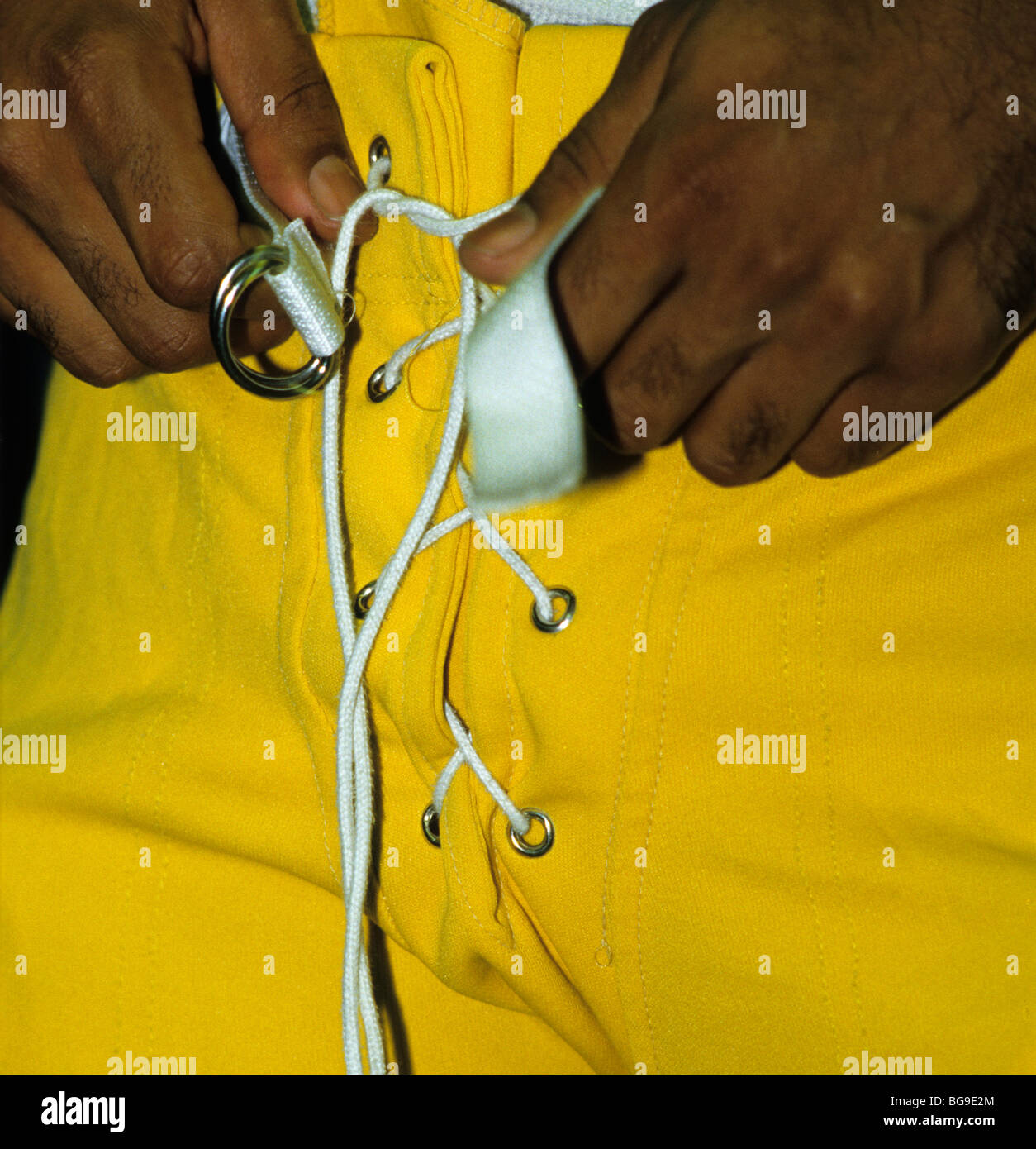 Adjusts his pants hires stock photography and images Alamy