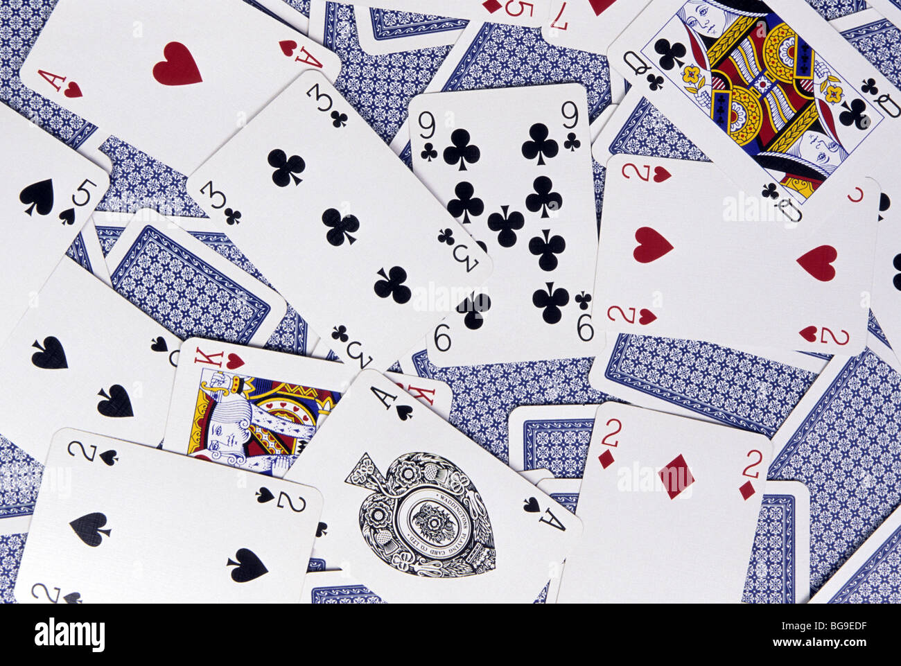 Playing cards scattered on a surface Stock Photo Alamy