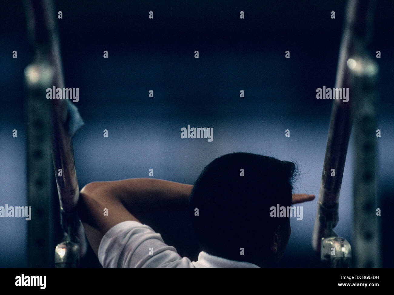 Coach checking measurement between parallel bars Stock Photo - Alamy