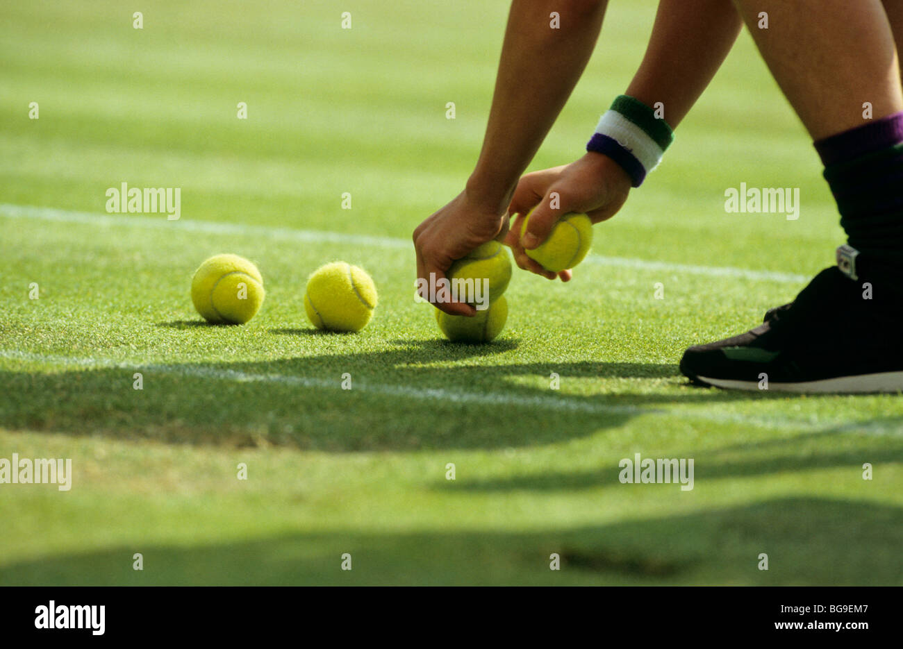 Boy Picking Up A Ball High Resolution Stock Photography And Images Alamy