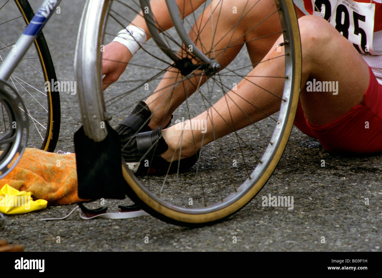 Triathlete switching from swim to cycle event Stock Photo