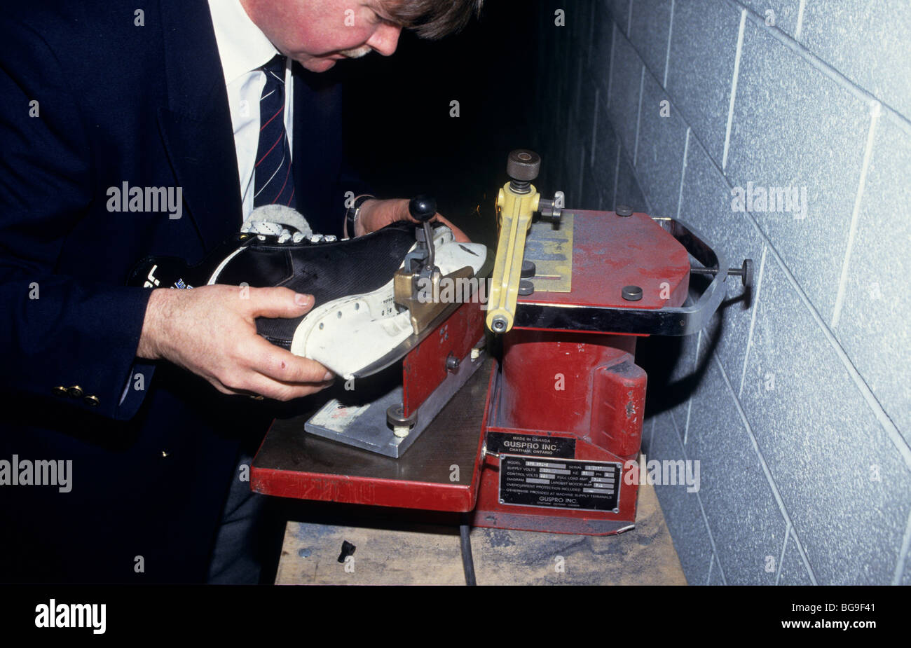 Sharpening blades on ice skates Stock Photo Alamy