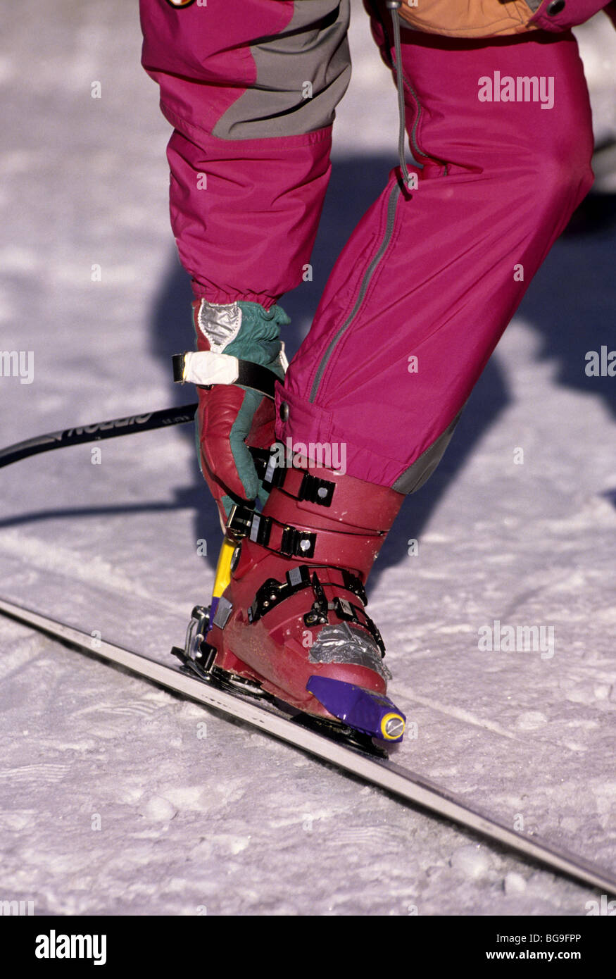 Fitting ski boots into the bindings Stock Photo Alamy