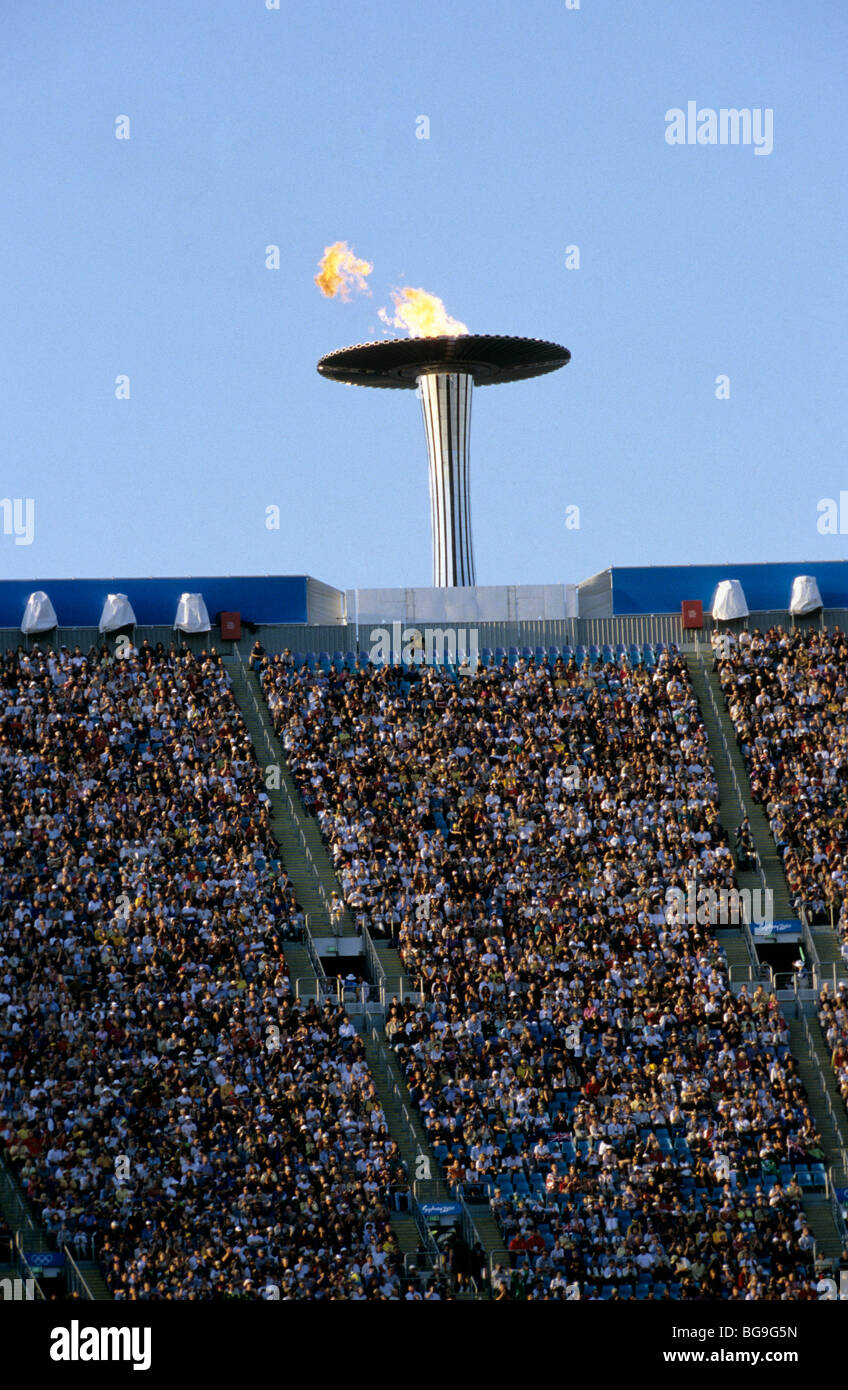 Olympic torch above a stadium Stock Photo Alamy