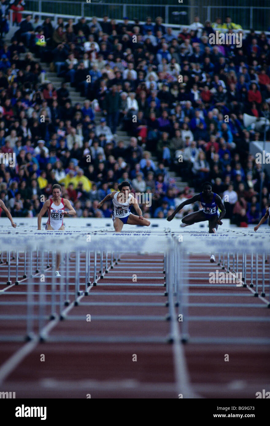 Athletes competing in 100m hurdles Stock Photo - Alamy