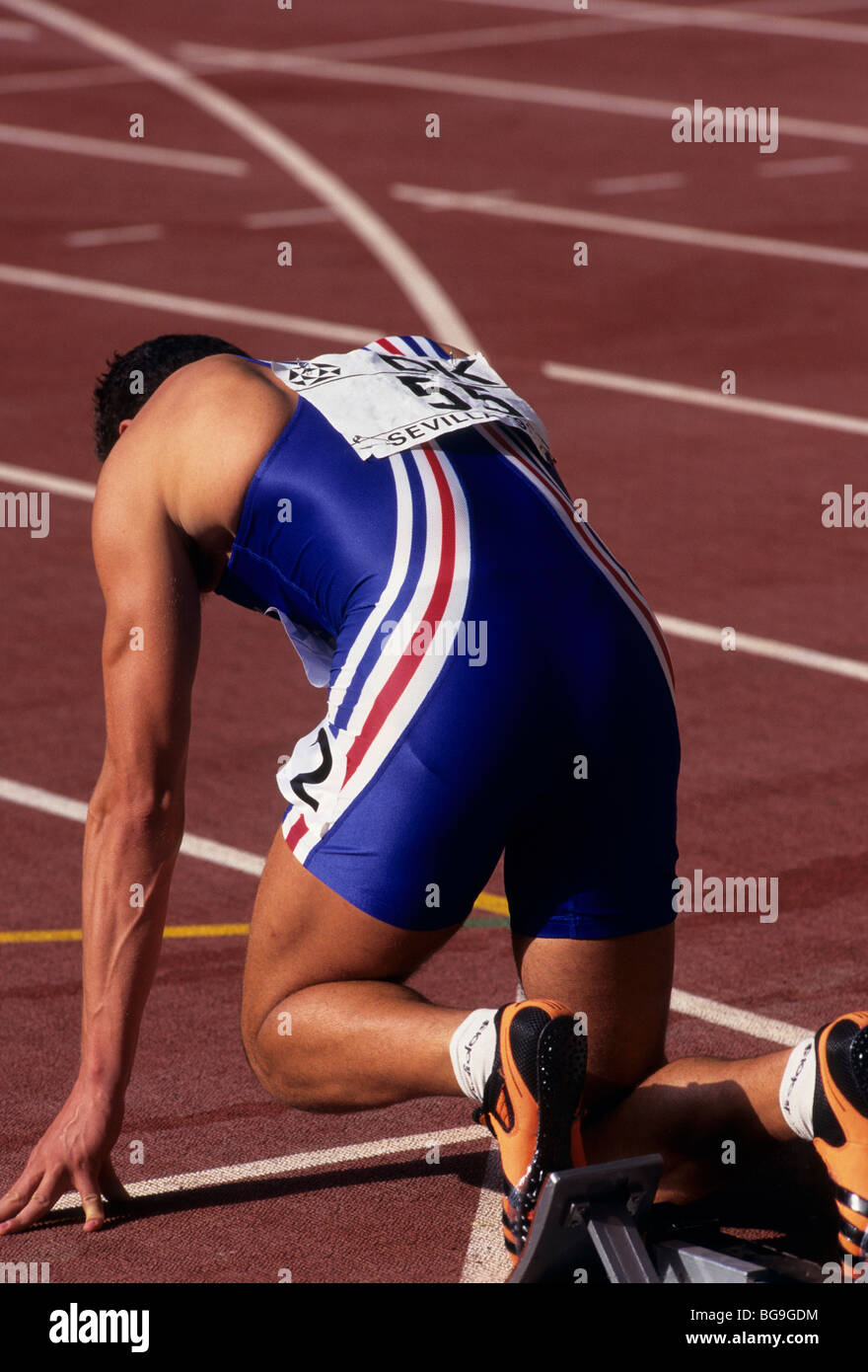 Sprinter in the starting block Stock Photo Alamy