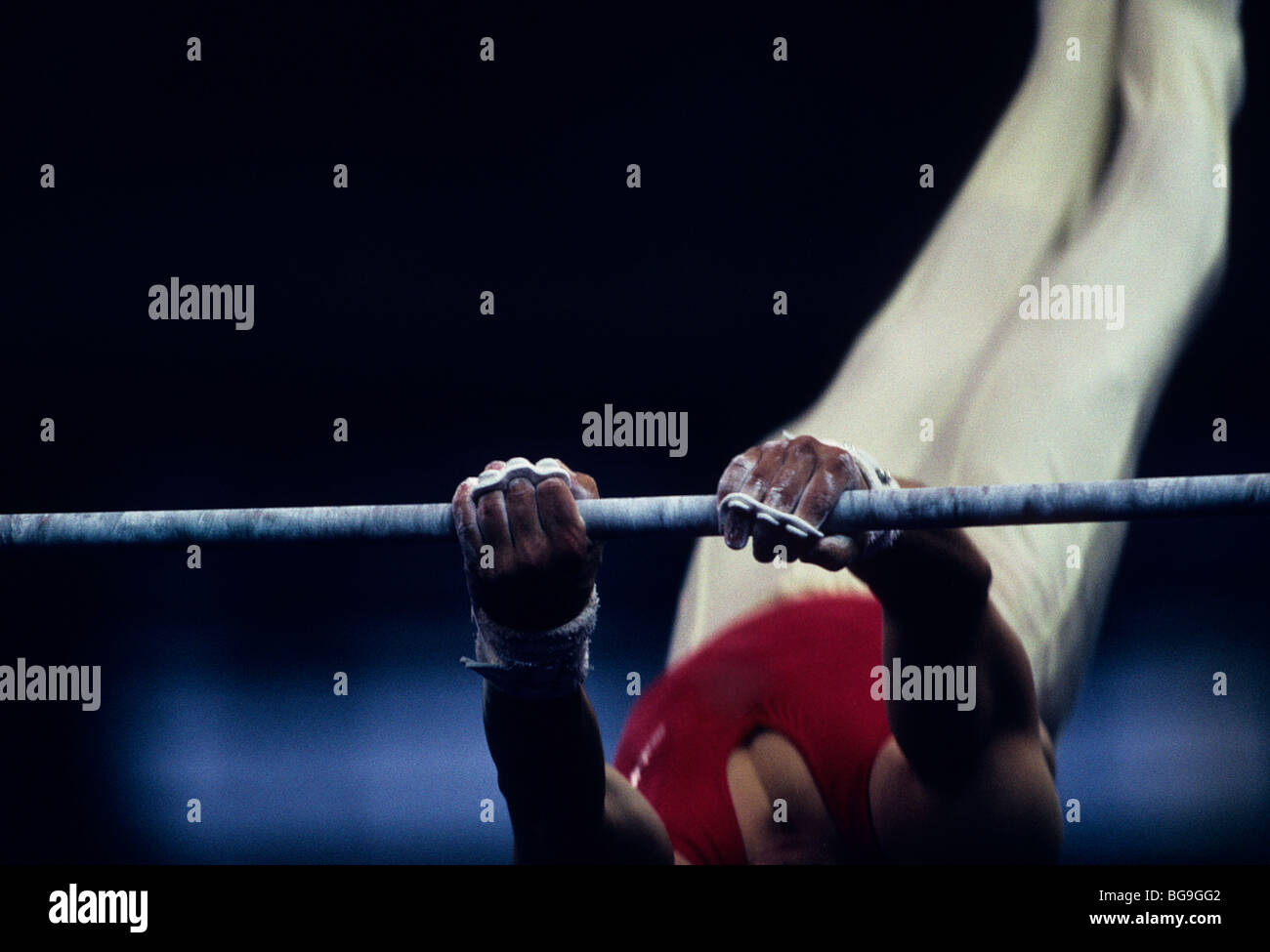 gymnast performing on high bar Stock Photo Alamy