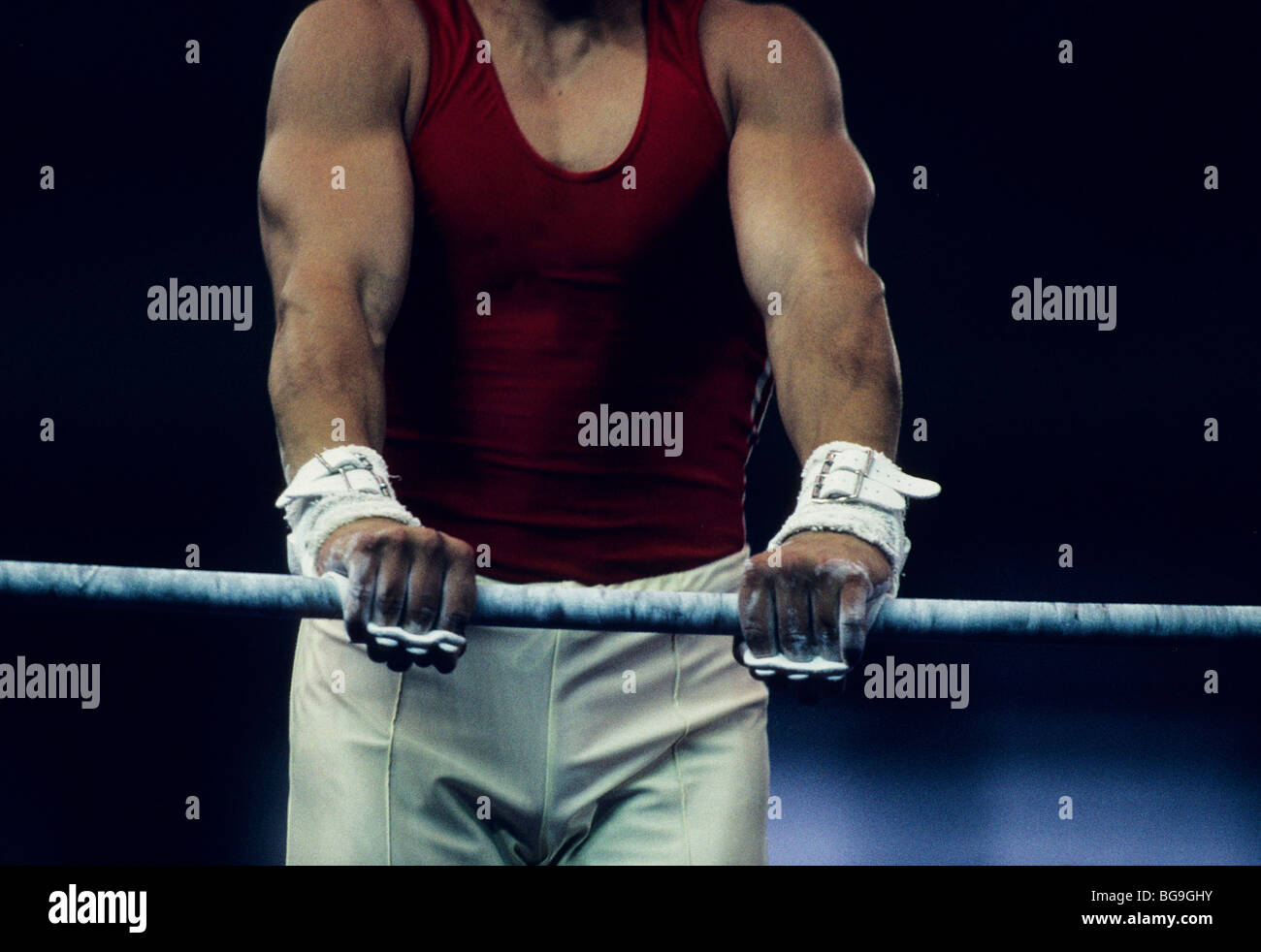 gymnast performing on high bar Stock Photo Alamy
