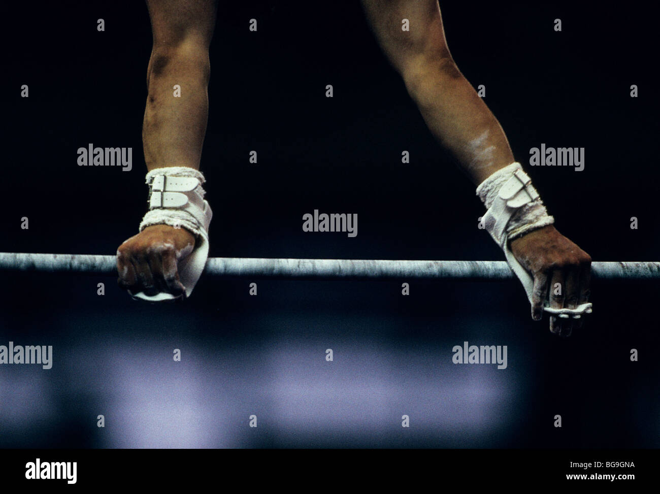 gymnast performing on high bar Stock Photo Alamy
